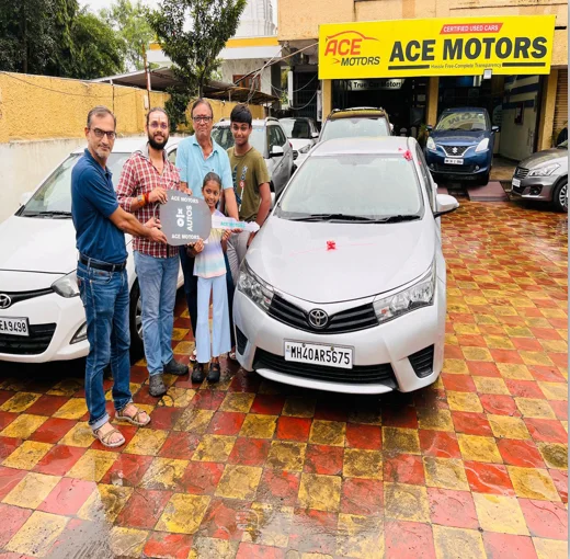 Onkar Vaidya and his family collecting the keys to his first car