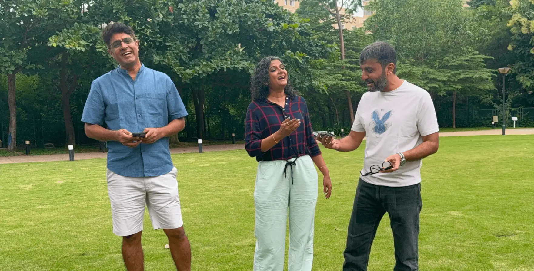 Artium’s founders performing together on a lawn