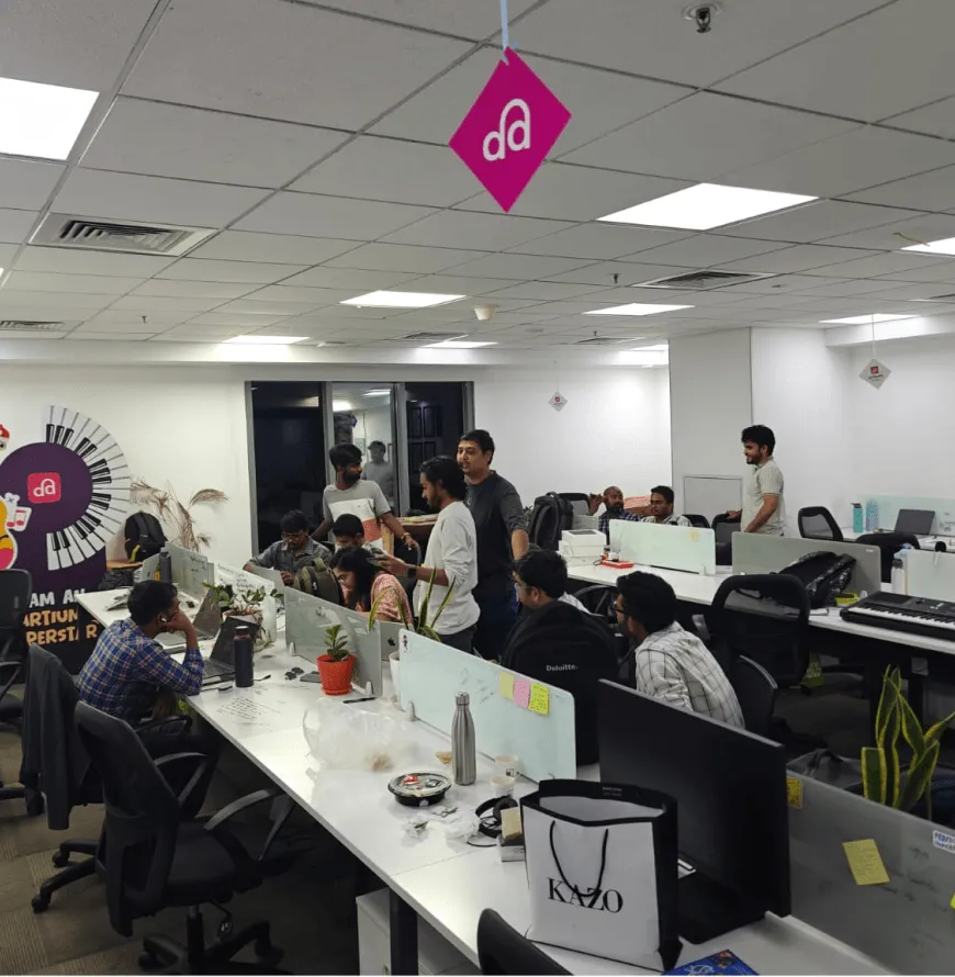 The Artium team at their desks in the office on release day
