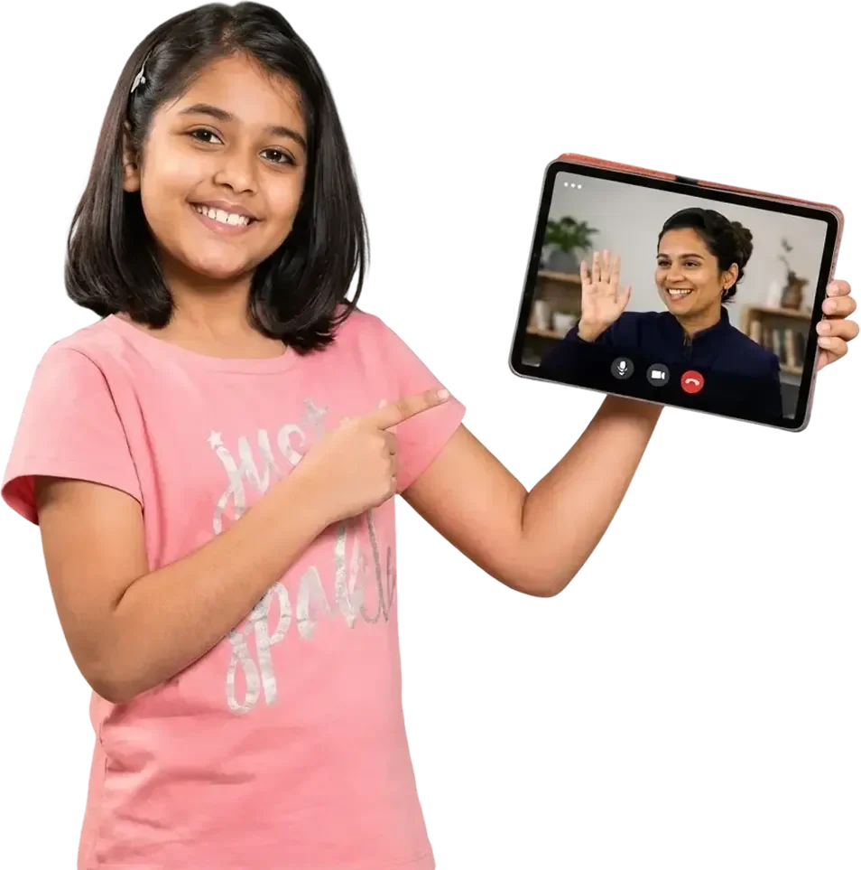 A young learner pointing to her Artium teacher waving from a tablet on a live video call