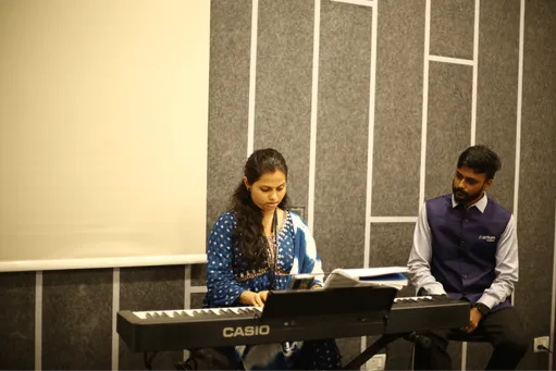 A learner playing the keyboard