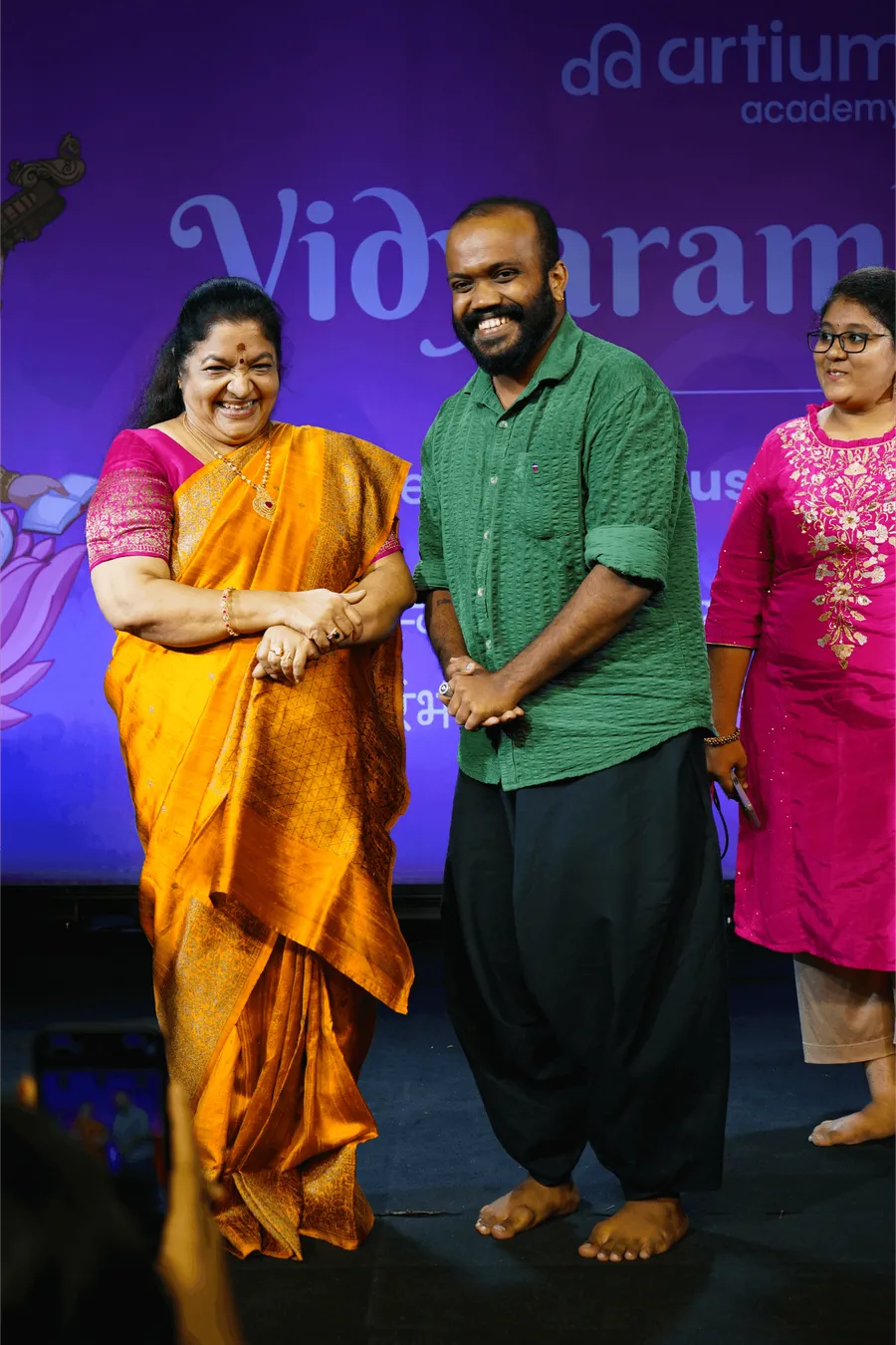 KS Chithra laughing with learners at a Vidyaarambham masterclass