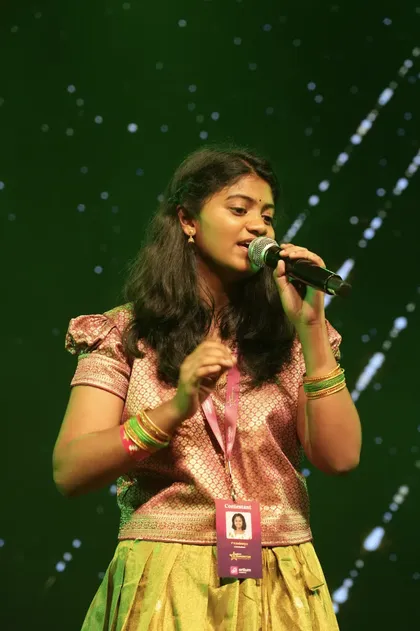 Ishita Reddy singing on stage