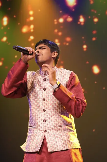 Vihaan Mehta singing on stage
