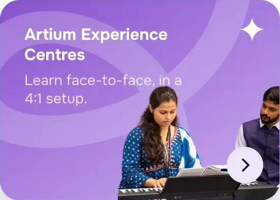 A student learning keyboard face-to-face with a teacher at an Artium Experience Centre