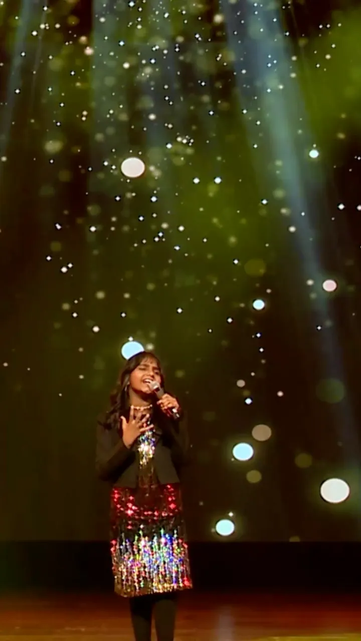 Geetha Janani singing Western vocals on stage at the Artium Superstar Season 2 finale
