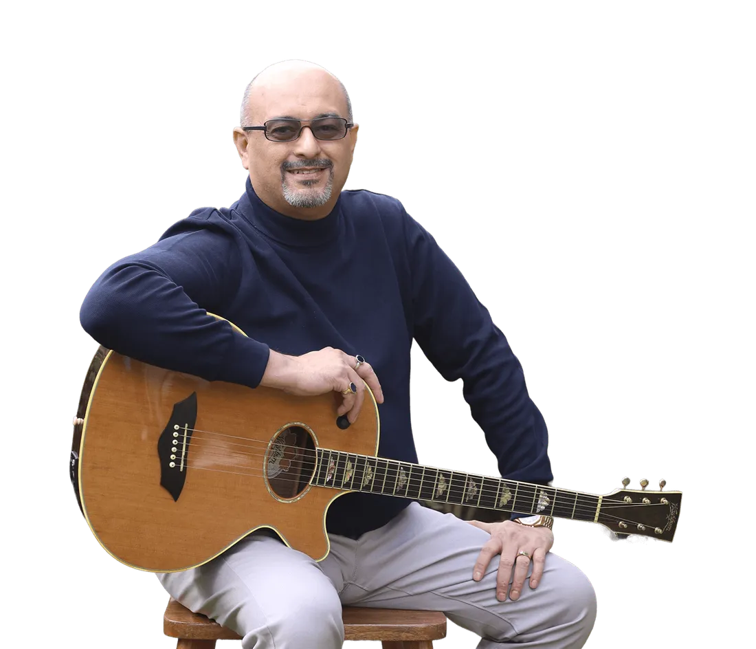 Louiz Banks with an acoustic guitar