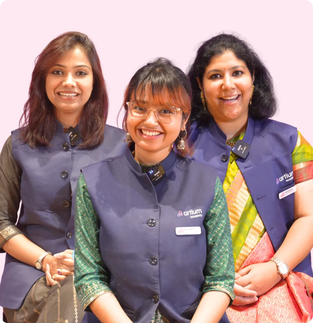 Three Artium teachers in their uniform