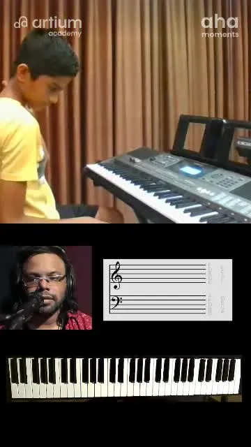A young learner playing the keyboard with his teacher in a live class