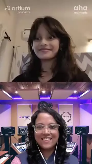 A young learner singing with her teacher in a live Western Vocals class