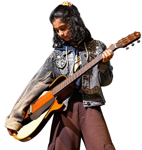 An Artium Originals artist with her guitar