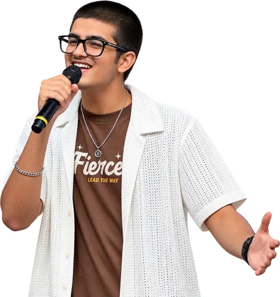 A learner singing into a microphone at an Artium Showcase
