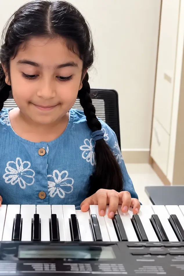 Krithi playing the keyboard at Artium Showcase