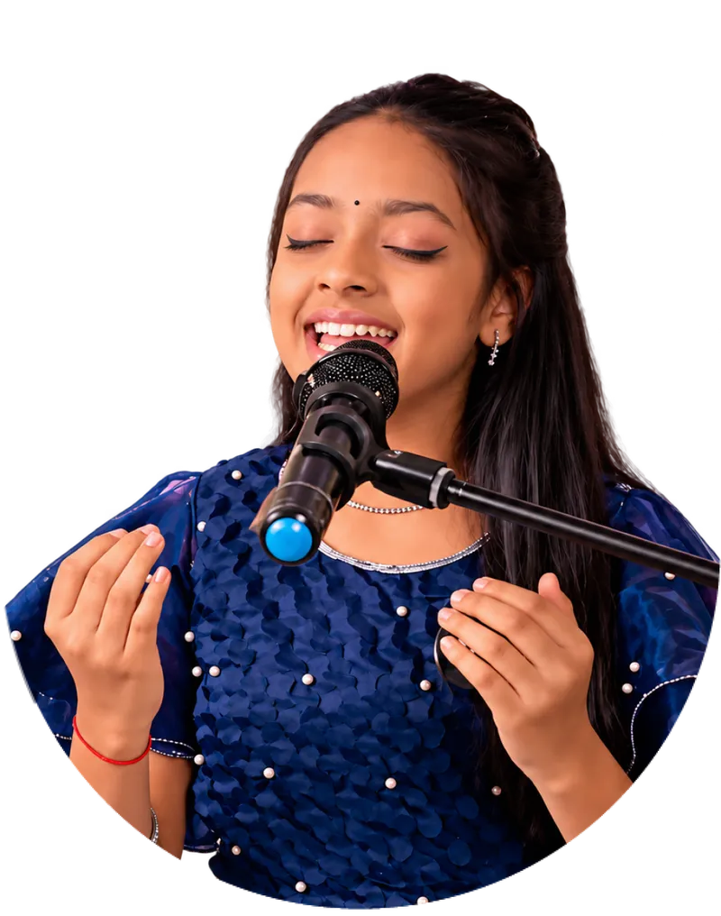 A young Artium learner in a sequinned blue dress singing at a microphone