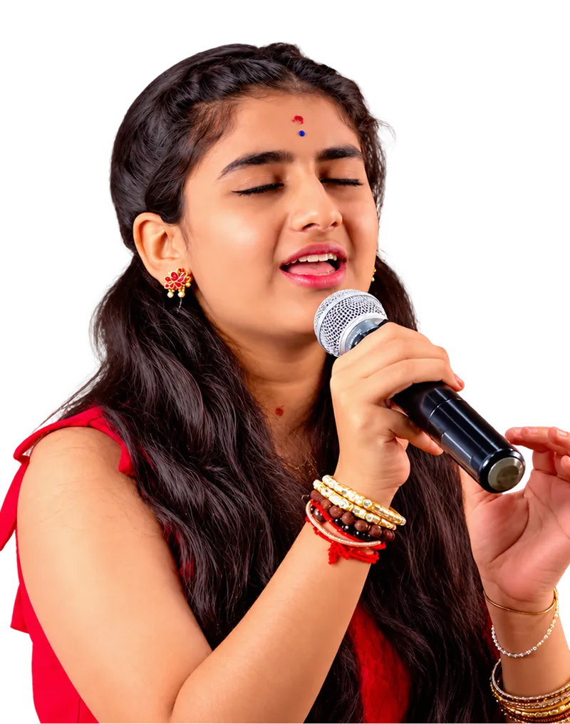 An Artium learner in red singing into a handheld microphone